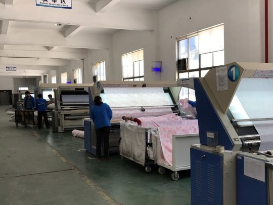 Fabric Inspection Area - Fabric is checked upon receipt from the supplier, any faults are tagged. Fabric is checked again after coating, any faults are tagged again